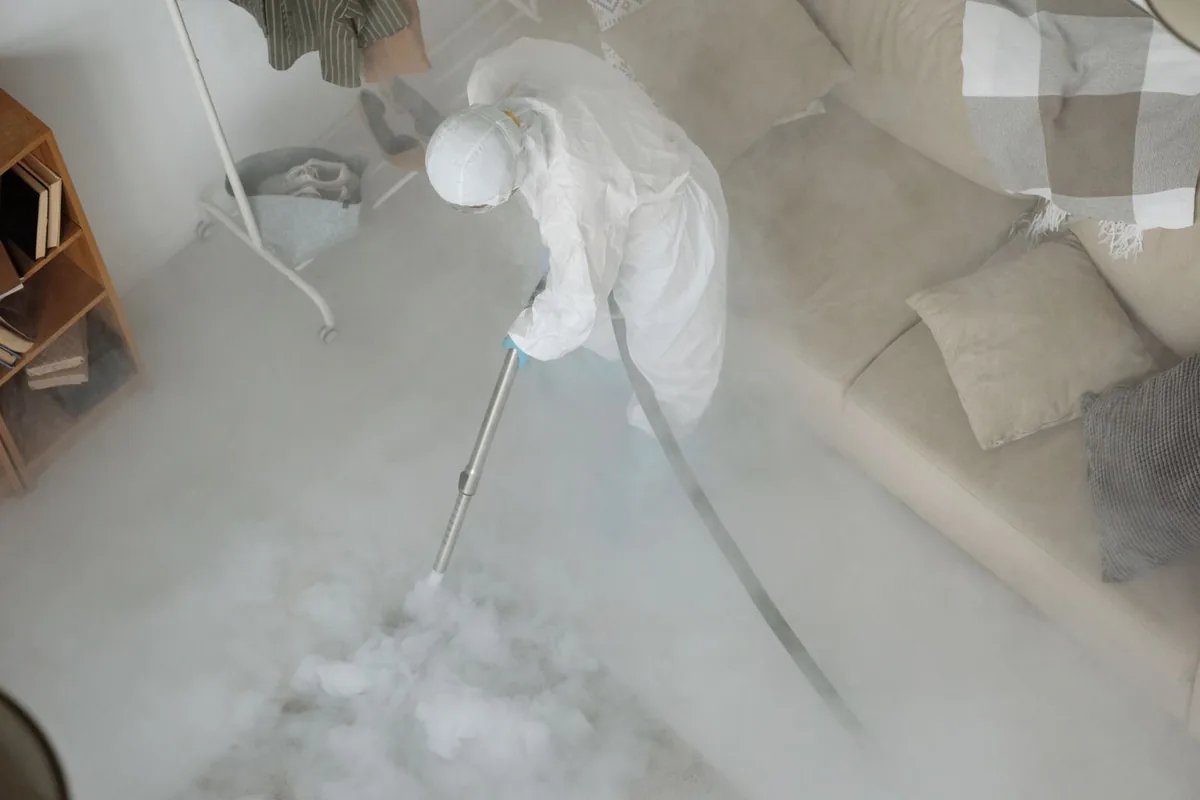 Biohazard cleanup technician in protective equipment, Rio, WI